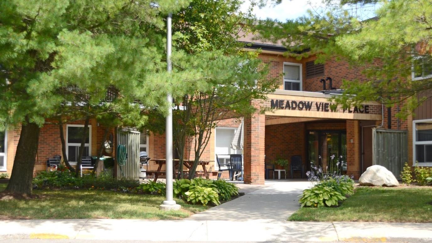 Exterior of 15 Spruce Street, Hillsburgh. It is a two-storey apartment building with the name "Meadow View Place" displayed over the entrance.