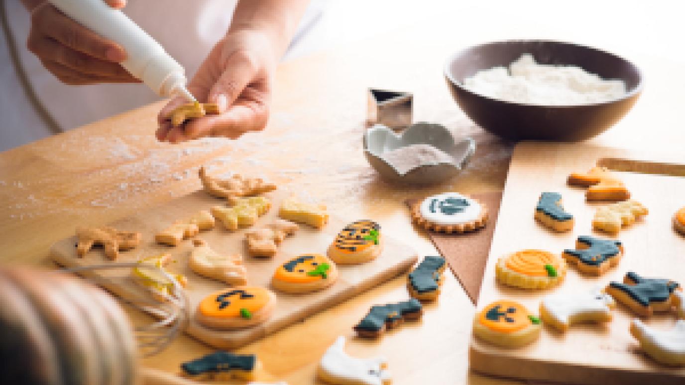 halloween cookies being decorated