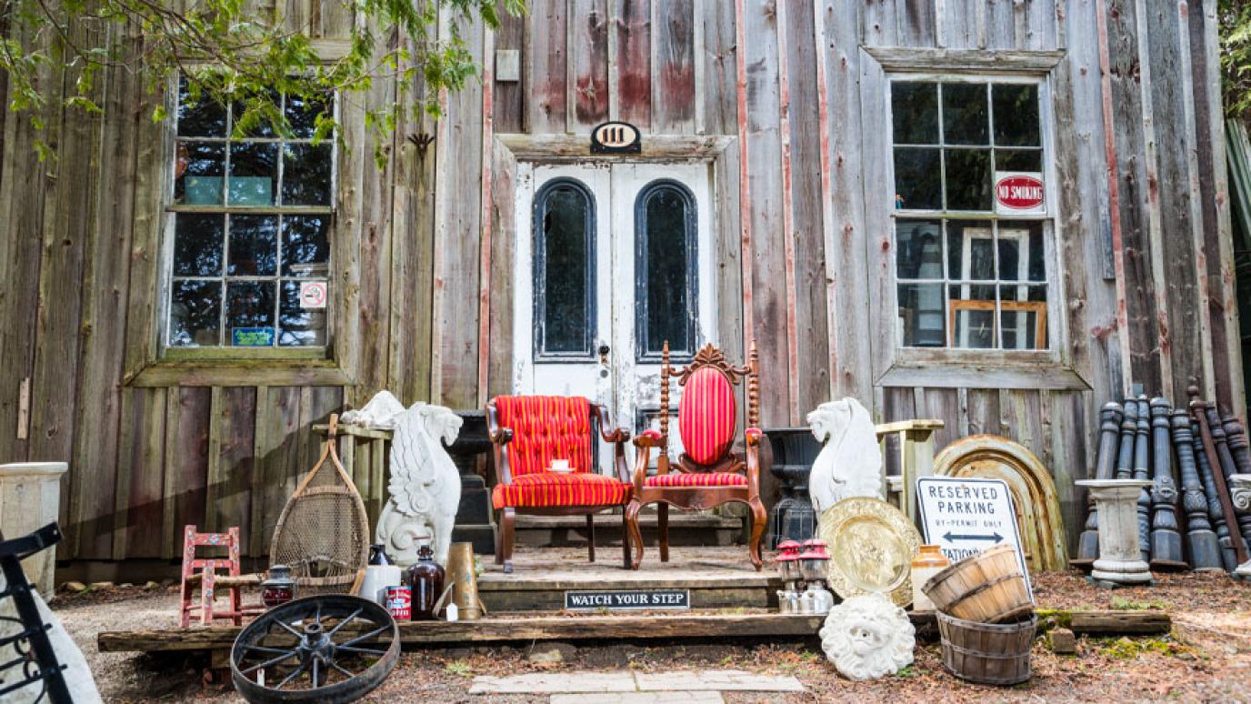 Eclectic items sit in front of a charming wood storefront at the Aberfoyle Antique Market.