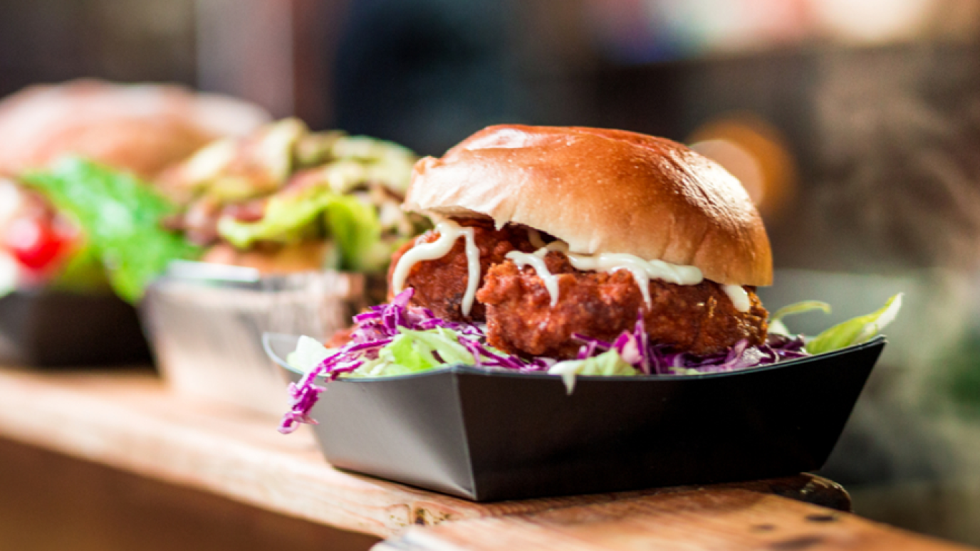 Delicious looking line up of burgers at a takeout counter