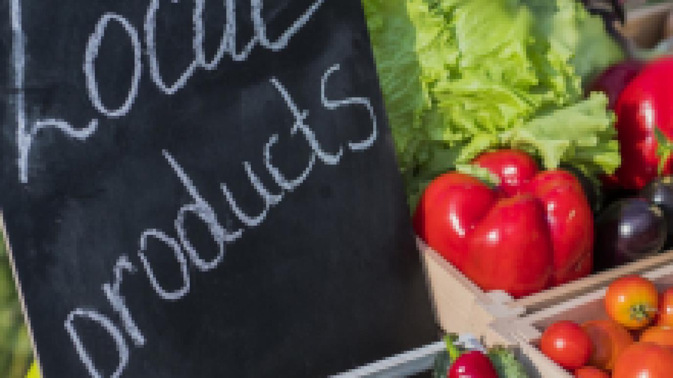 Chalkboard sign that says local products