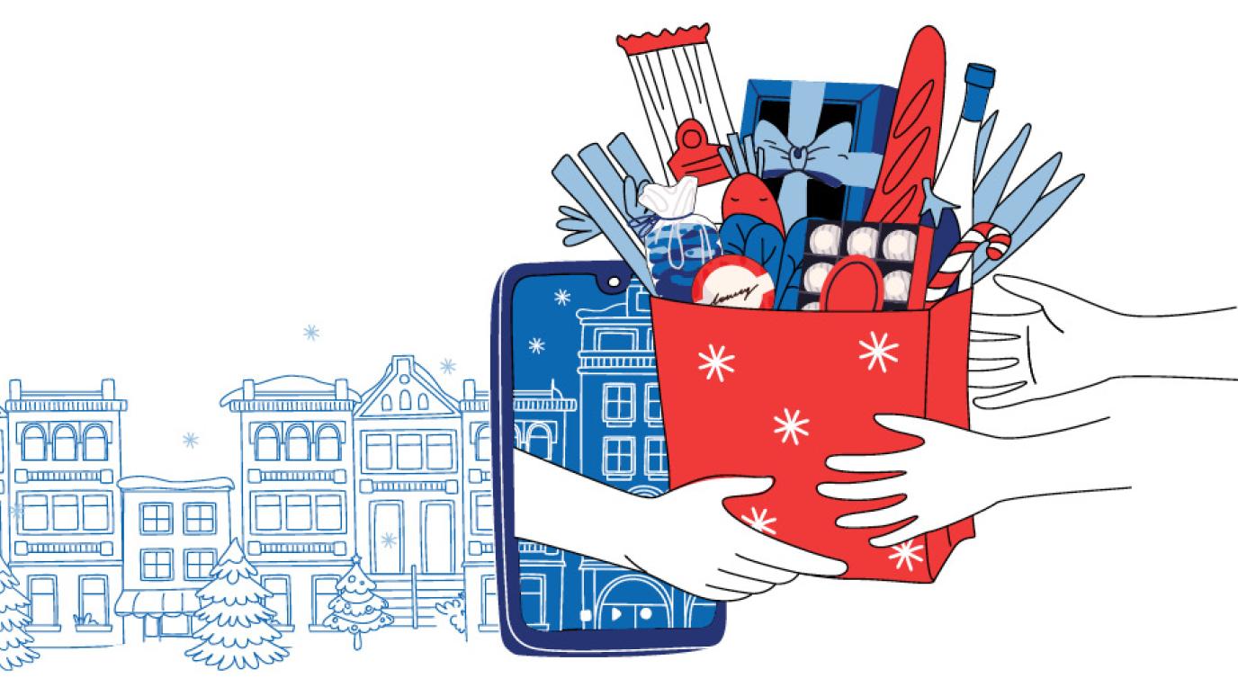 Hands hold a gift bag full of holiday food gifts against a snowy urban backdrop. The gift bag is being passed through the screen of a mobile phone indicating an online order.