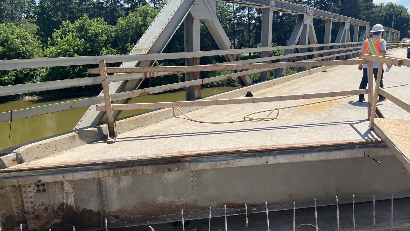 Section of bridge with exposed concrete and metal
