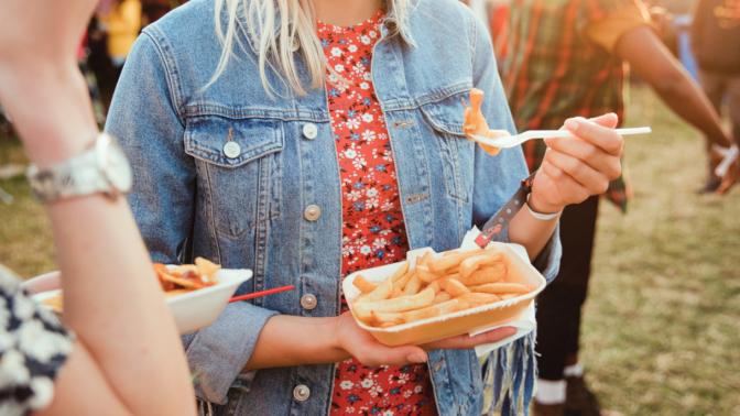 Woman Holding Fries to eat