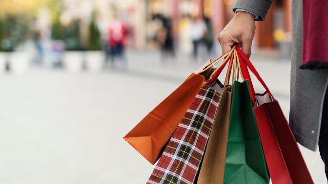A person holding shopping bags