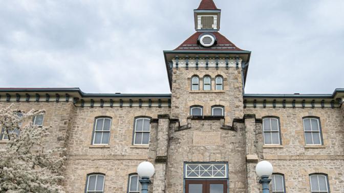 Front of the historic Wellington County Museum and Archives limestone building