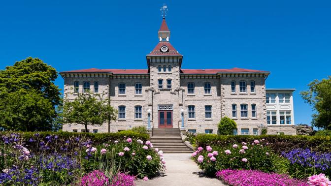 The front of the Museum and Archived building with the front gardens in full bloom