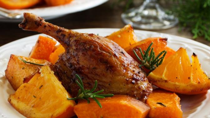 quail displayed on a plate with sauce and root vegetables