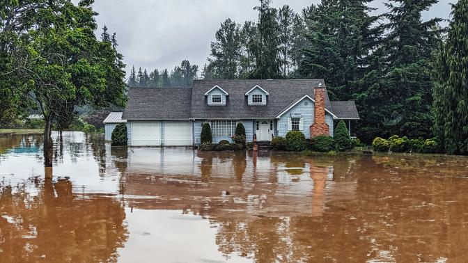 A house submerged in flood water.