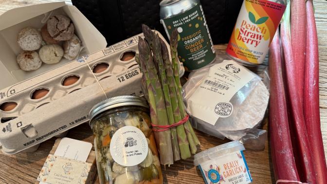 Farmers' market box items placed on a table.