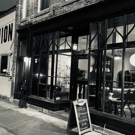 A photo of the frontage of Bistro Reunion in Black and White.