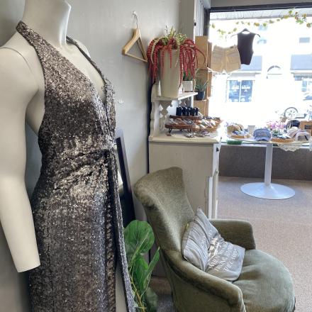 Mannequin with dress on, green chair