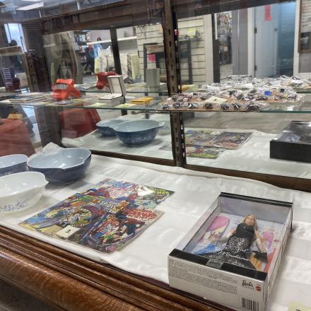 Display case with bowls and books