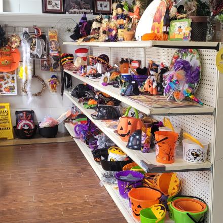 Halloween themed party items displayed on the store shelves.