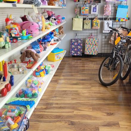 kids items, bikes and gift bags on display