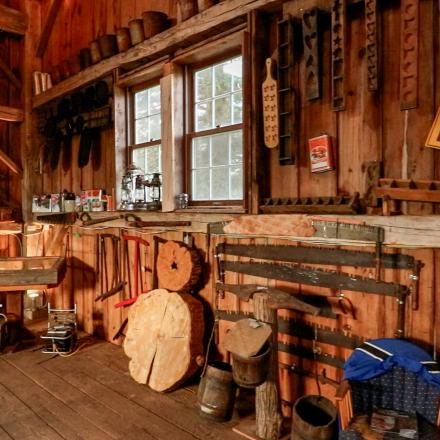 rustic wooden interior with exposed beams and equipment maple museum of Ontario
