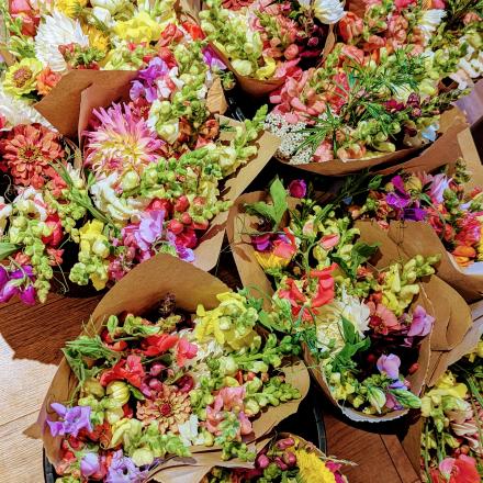 bouquets of flowers wrapped in brown paper