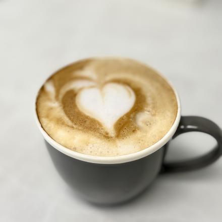 close up of coffee with heart latte art