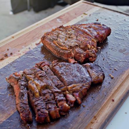 closeup of smoked ribeye on a cutting board