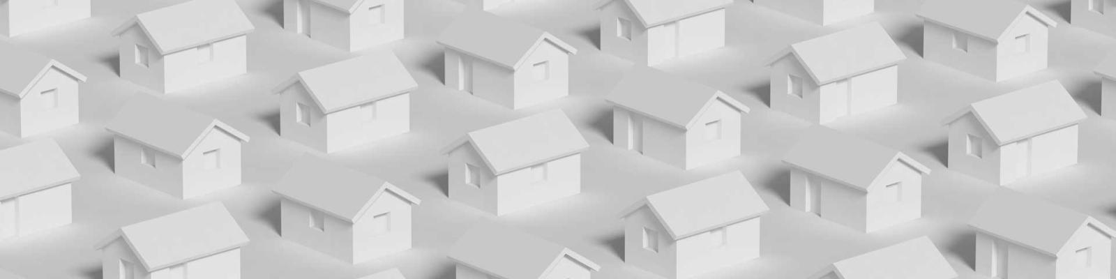 Rows of identical white paper houses