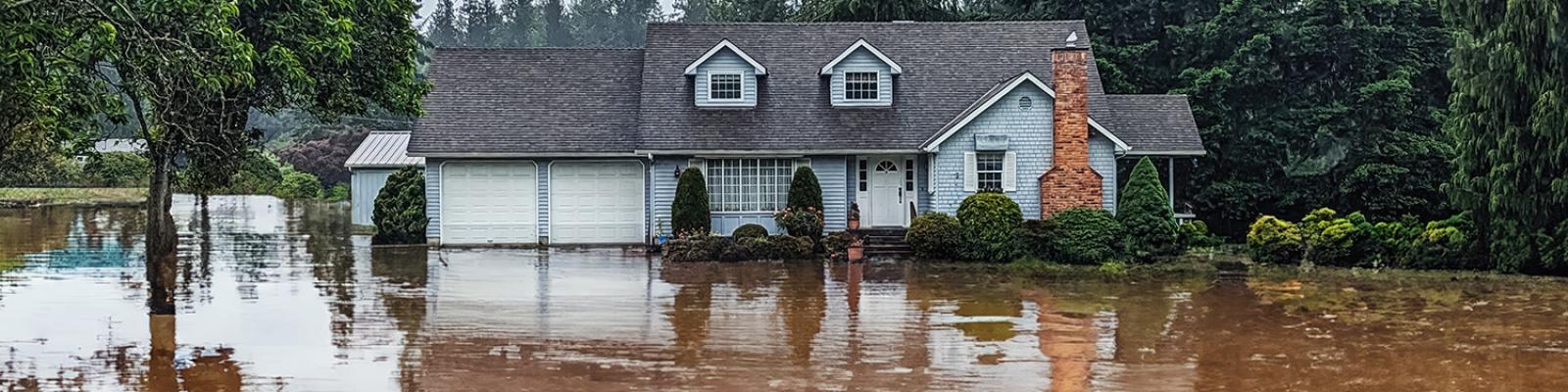 A house submerged in flood water.