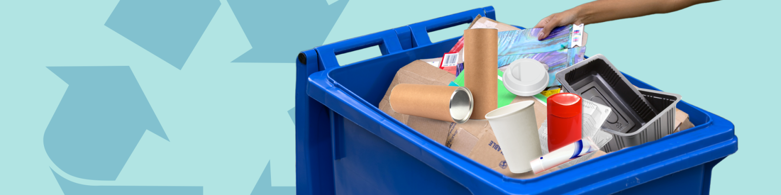 an arm is extended placing recycling materials into a blue recycling cart