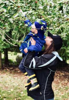 woman and boy picking apples