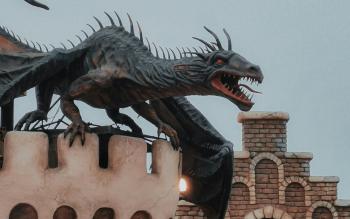 dragon stone carving on top of a castle