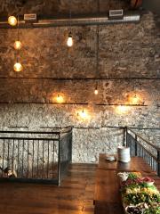 view of loft with lights, table, plates and food