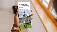 A person is holding WCMA guide