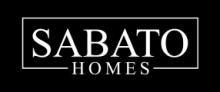 The word ‘SABATO’ in large white serif letters above ‘HOMES,’ framed by a thin white rectangle on a black background.