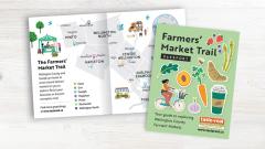Farmers' Market Trail map and guide cover featuring a map of Wellington County and colourful illustrations of local produce and a person on a bicycle